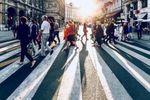 Crowded city street of people walking in Centered One blog about triggers that drain empaths