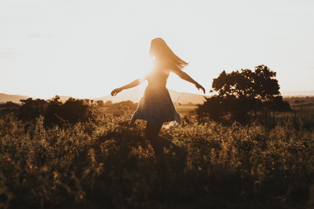 dancing girl at sunrise in blog by erin moore centered one about what is self-talk