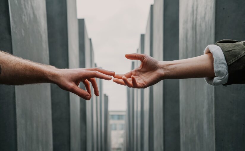 hands reaching in blog by erin moore centered one about what is toxic empathy