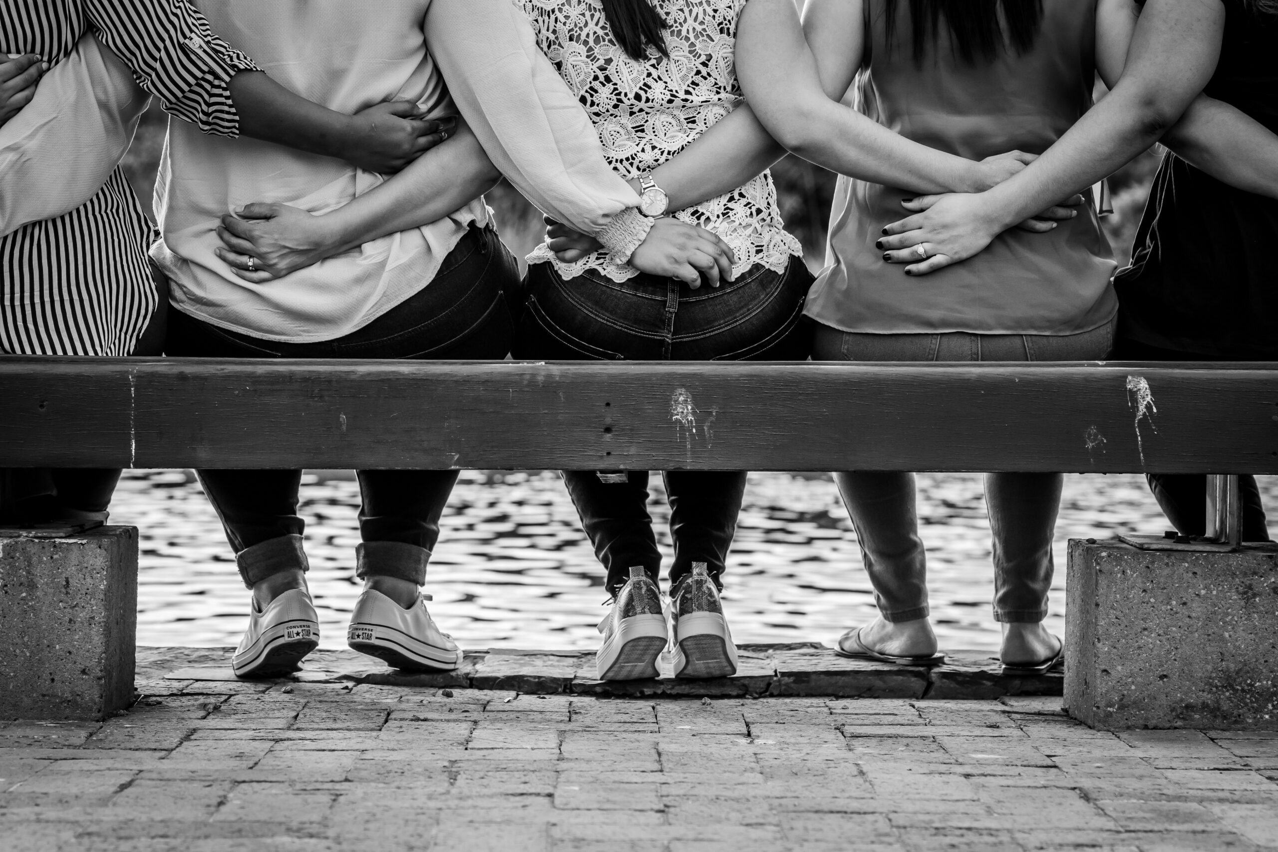 friends linking arms in blog by erin moore centered one about trauma bonded friendships