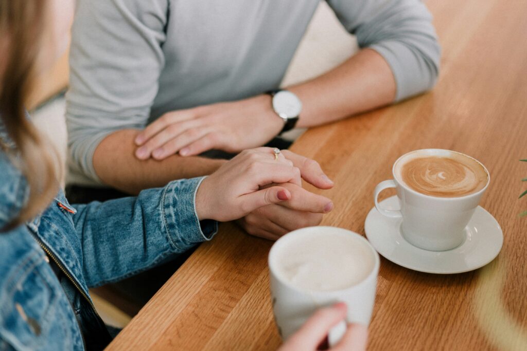 couple having coffee together at table in blog about narcissist enabler by erin moore centered one