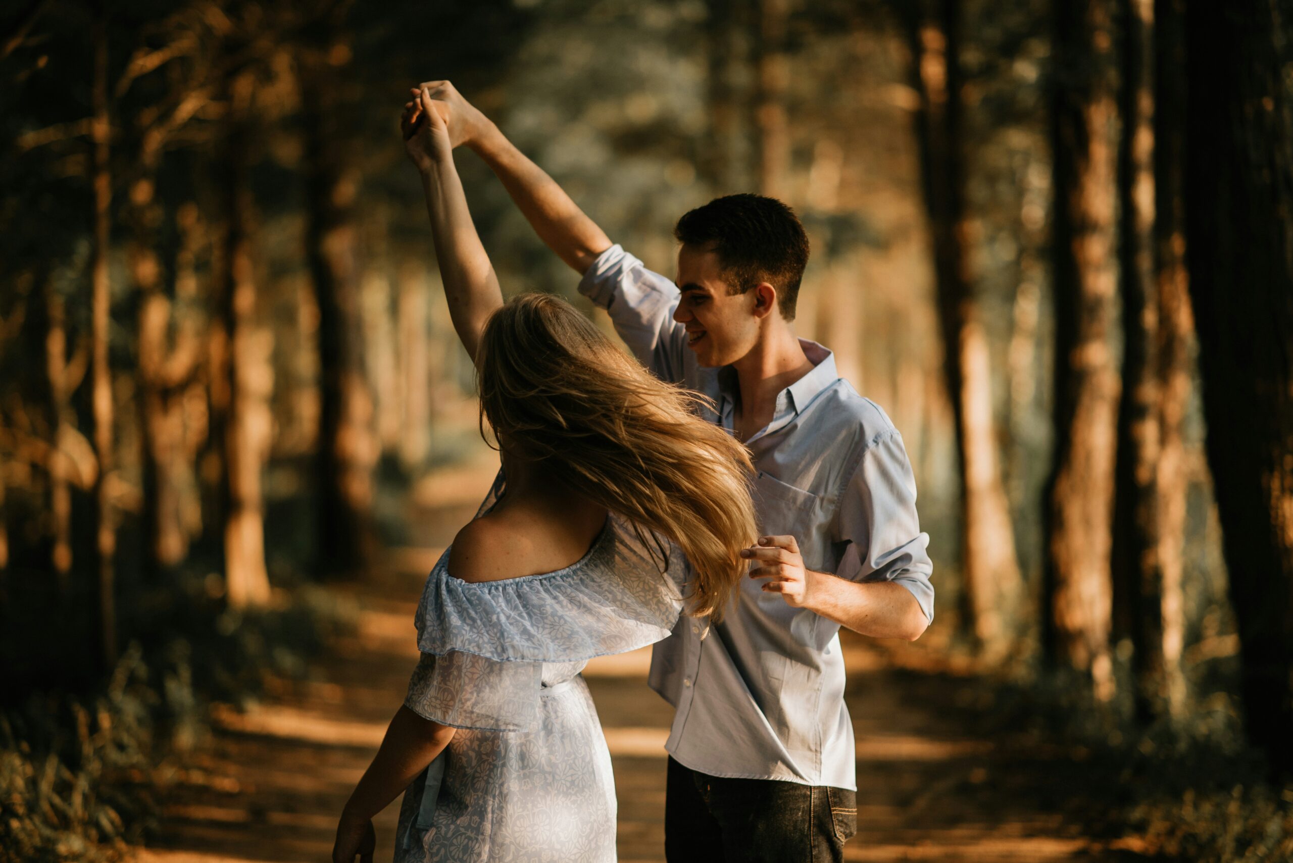 couple dancing in forest in blog about love bombing by erin moore centered one