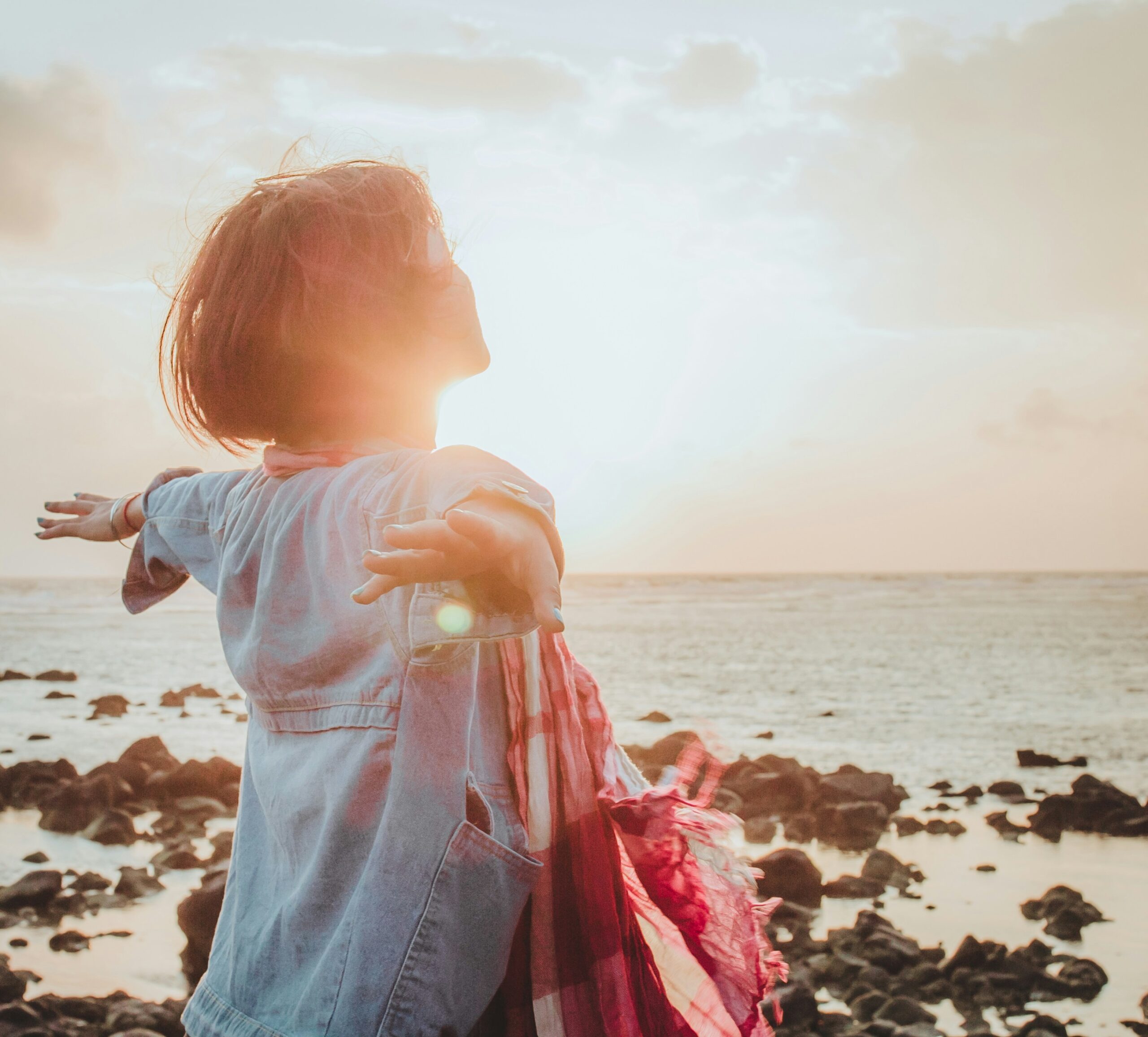girl breaking free in blog about signs of trauma bonding by erin moore centered one