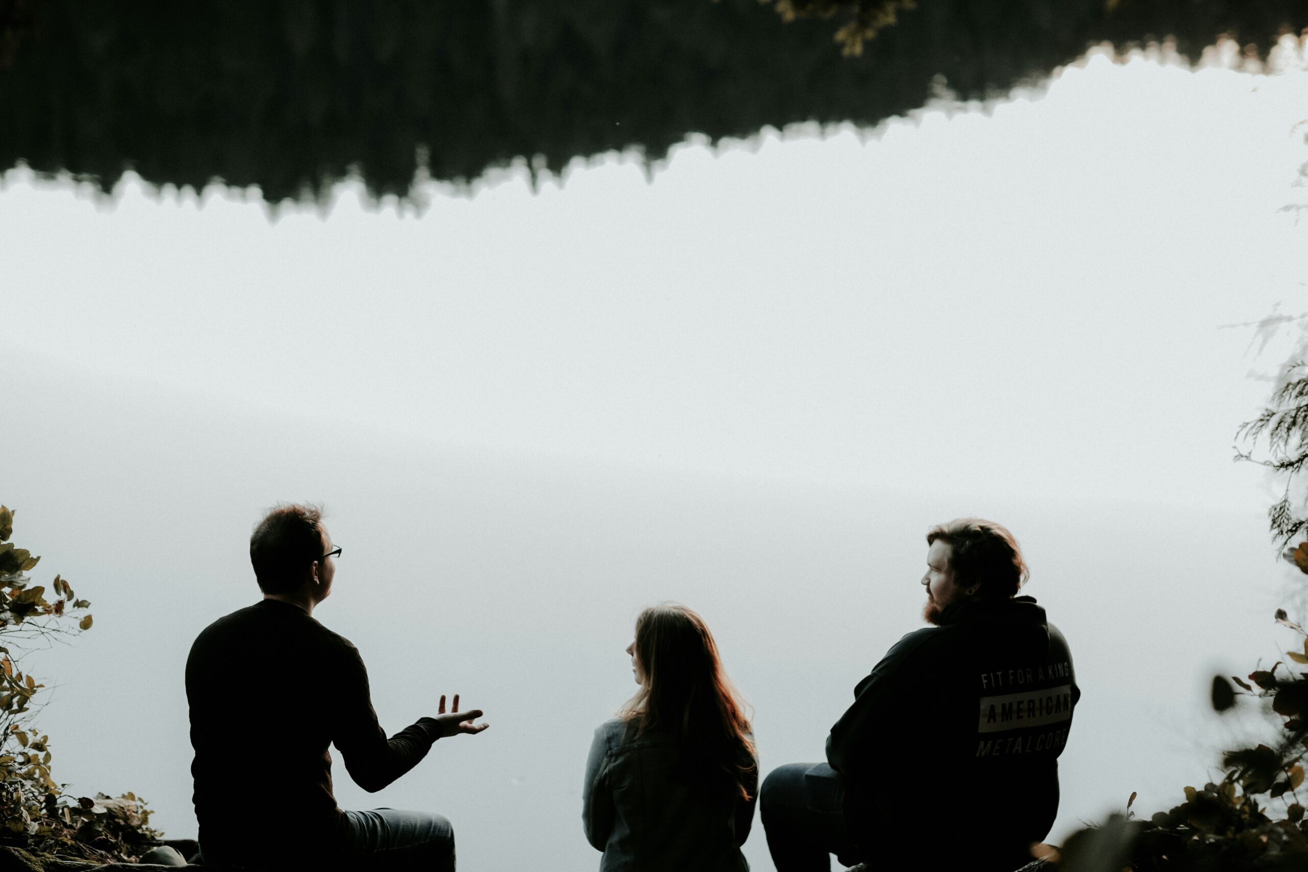 frustrated people talking by the water in blog by erin moore centered one about avoidant defense mechanisms