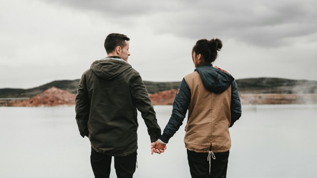 couple holding hands in blog about how to forgive by erin moore centered one