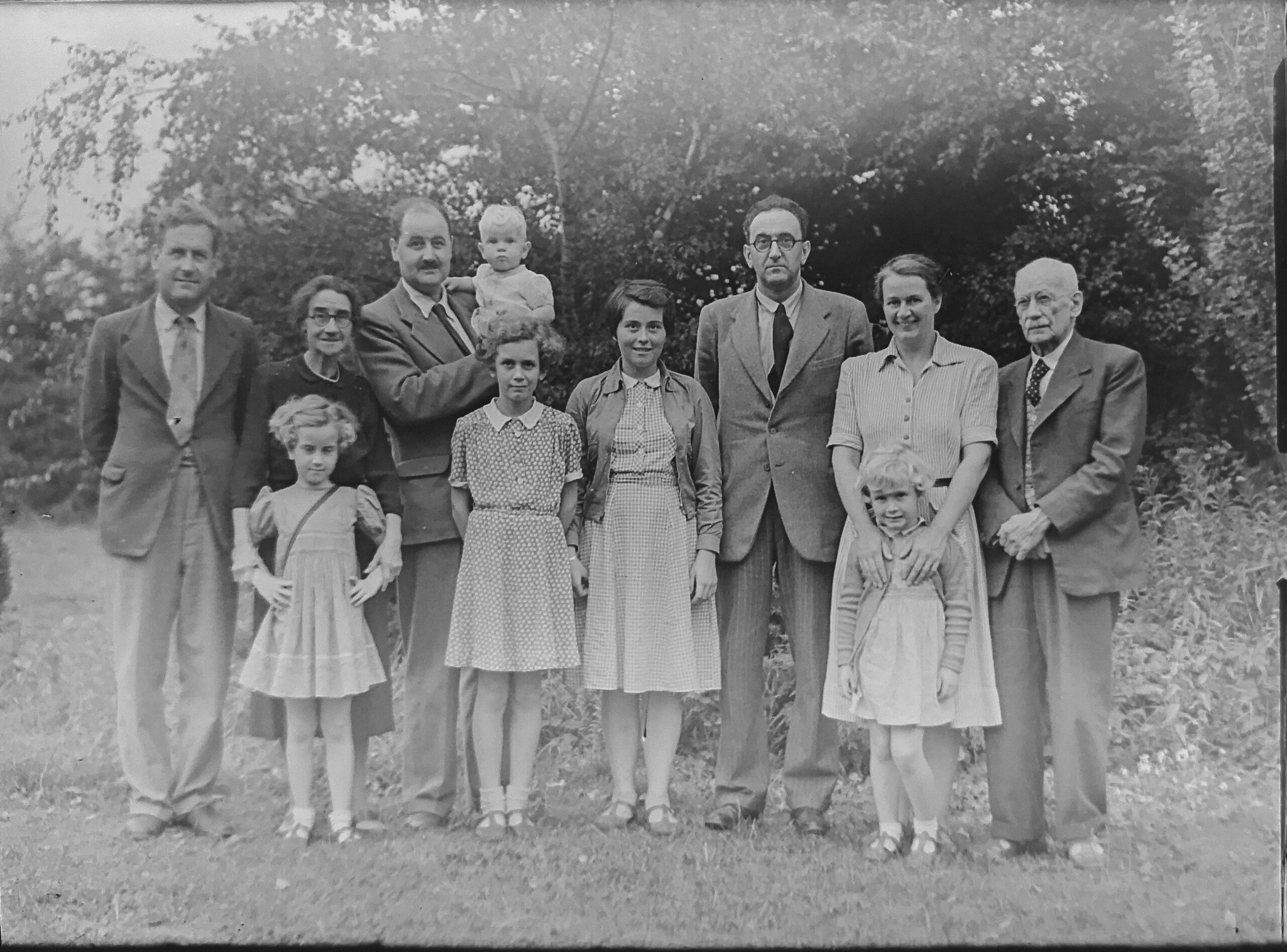 grayscale old family photo in blog about how to heal generational trauma by erin moore centered one