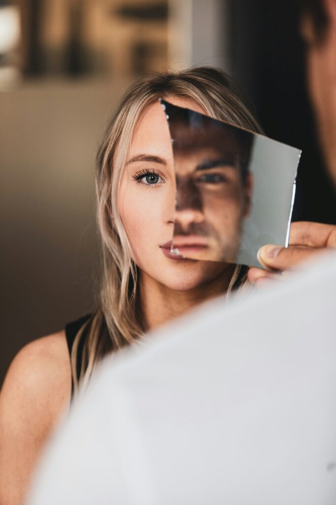 broken glass mirror woman man looking in blog about narcissistic abuse