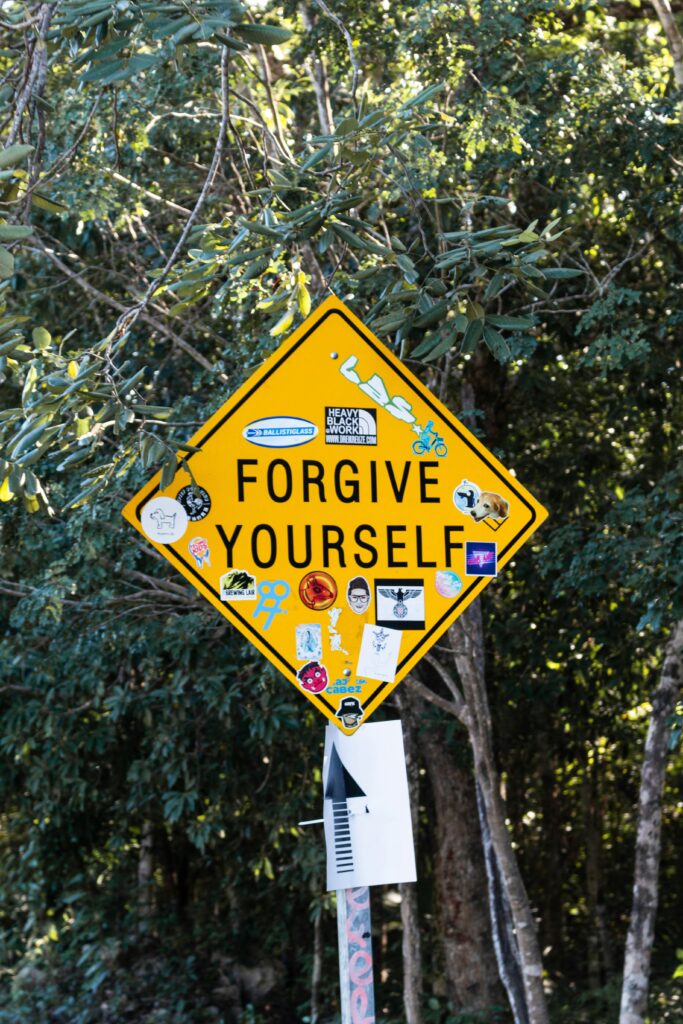 street sign forgive yourself in blog about how to let go of resentment by erin moore centered one